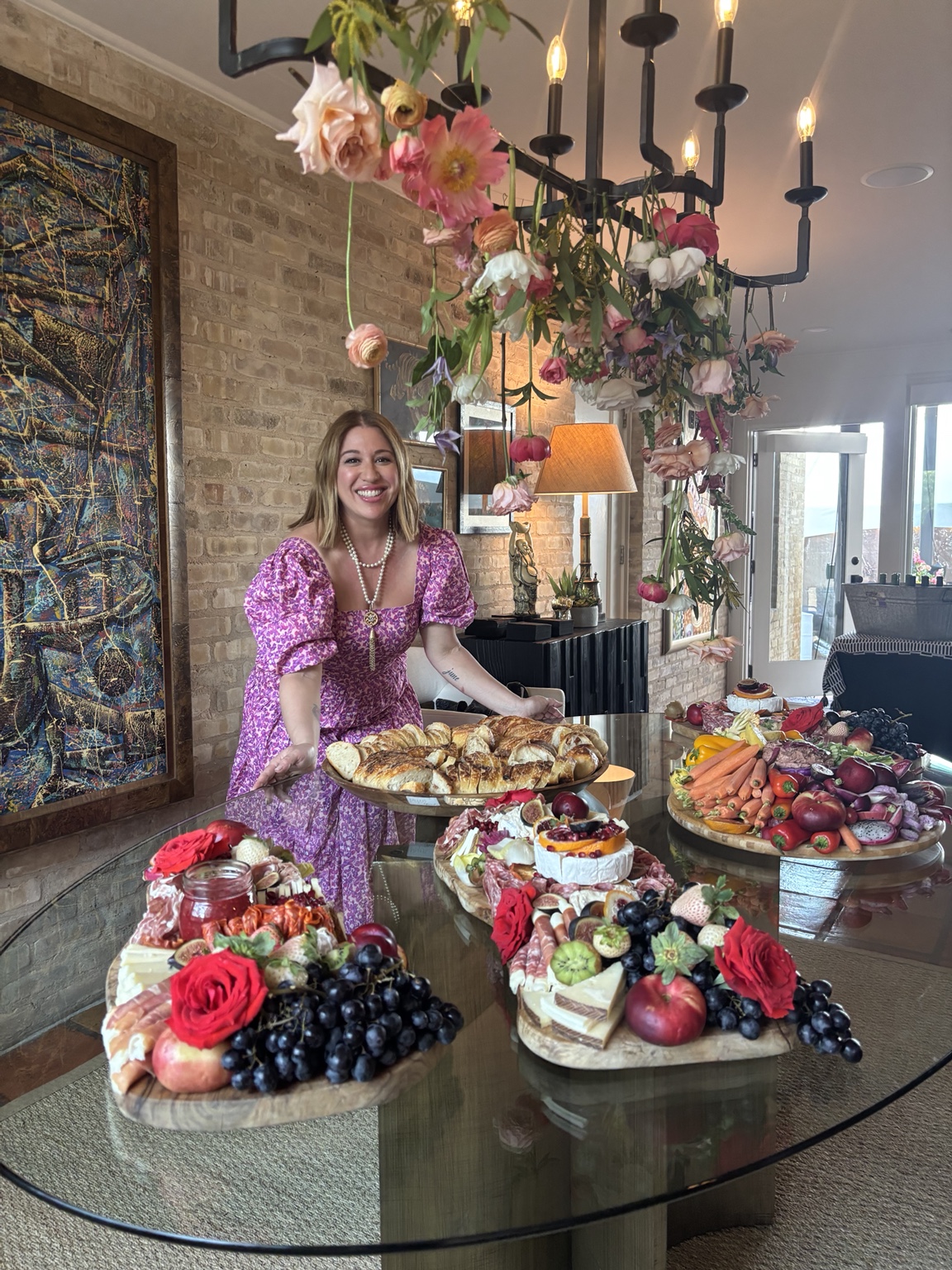 Chef Marissa Fisk presenting an abundant artisanal grazing table at a private Austin event